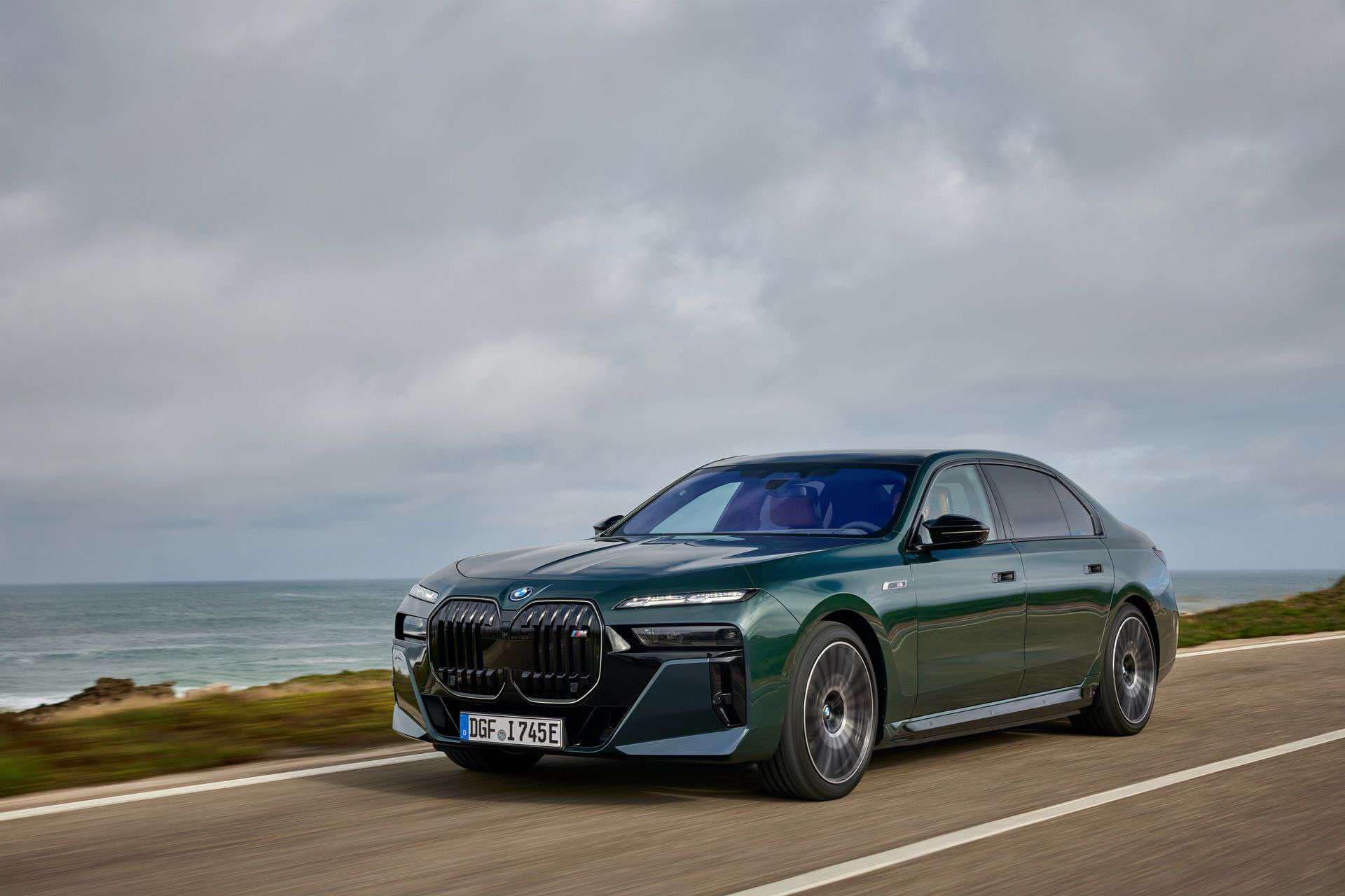 The front of a modern dark blue BMW 7 series sedan.